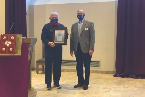 Bill Nosek receiving the Certificate of Merit Award from Grand Knight Murray Claassen