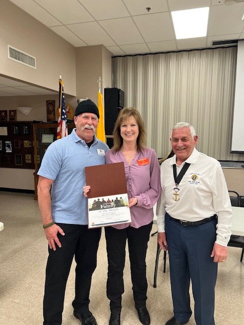 Brother Knight Chris and Donna Mullaney with the Family of the Month Award presented by Grand Knight John Weirdert