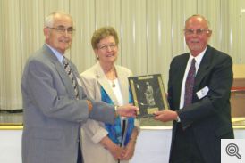 Marvin and Lucy Young receiving award from Bill Roe
