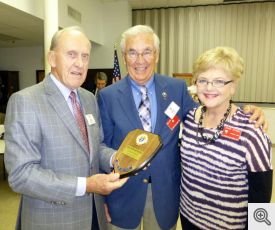Grand Knight Bob Honzik presenting award to Milt and Janice Spaniel