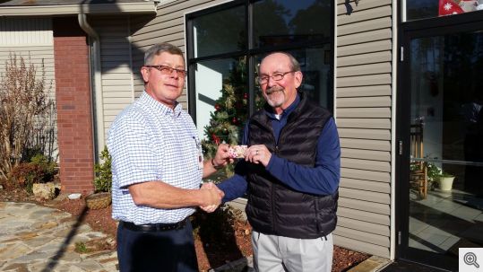 Ed Doyle presents a gift card to Ron Maguire of Alternative Learning Experience