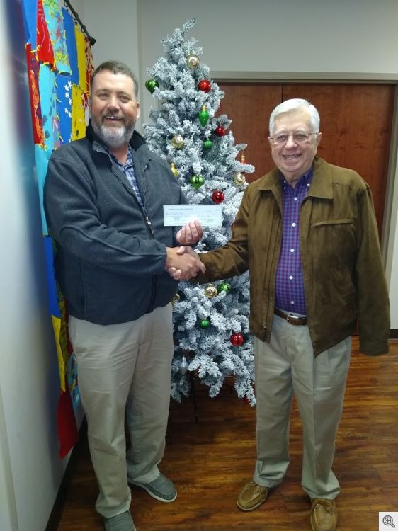 Sir Knight Walter Free presenting check for $5,800 to Brett Chancellor