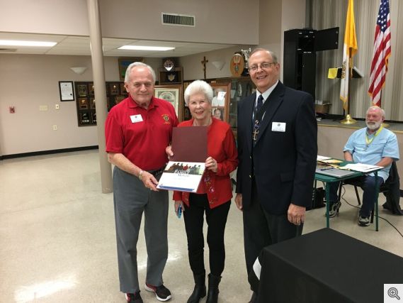 Grand Knight Murray Claassen presenting the Family of the Month Award to Bill and Kathleen Nosek