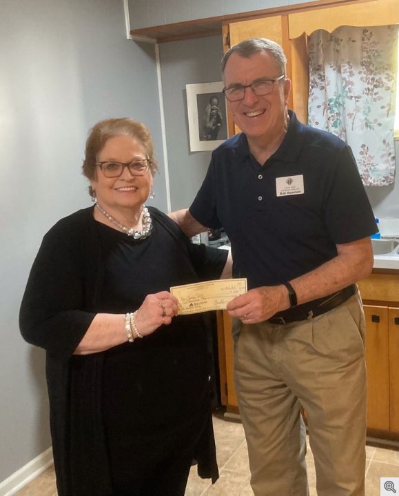 Bob Bowman presenting $2,000 check to Joann Carter at ChangePoint Resource Center in Hot Springs