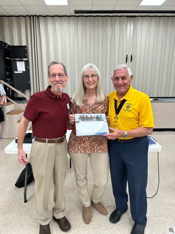 GK John Weidert presenting Jerry and Alison Kordsmeier the September Family of the Month Award