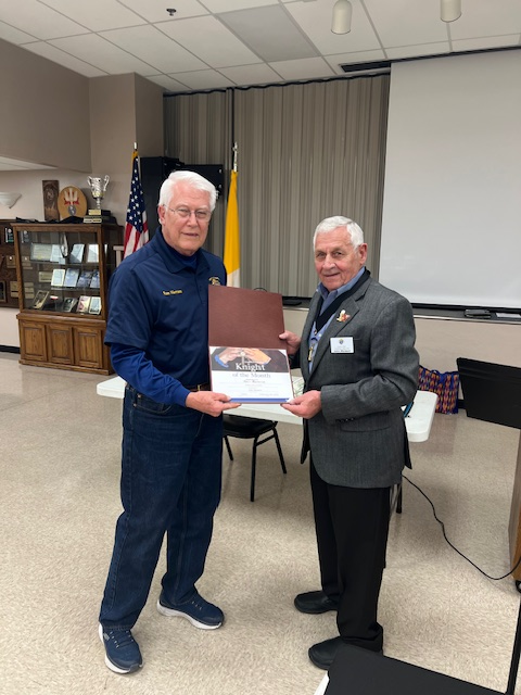 Brother Russ Harrison accepting the Knight of the Month Award from GK John Weidert