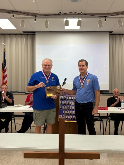 Randy Schnoebelen receiving the Gavel Plaque and Pin from Pat McGannon 