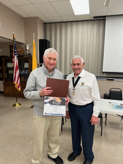 Brother Knight Mike Kerwin Receiving the Knight of the Month Award from Grand Knight John Weidert